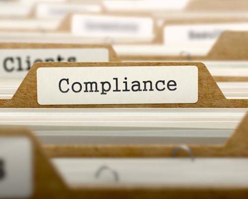 IT Compliance Concept with Word on Folder. IT Compliance